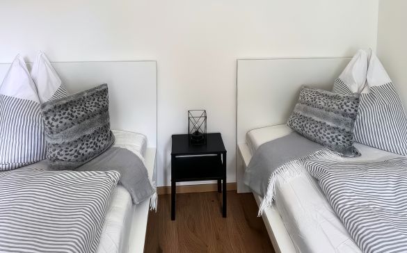Two single beds with bedside table